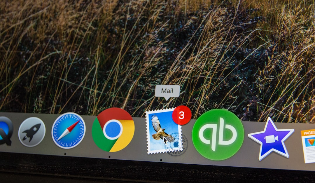 laptop with email inbox and clock