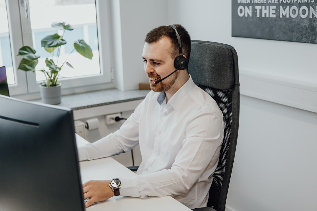 customer support agent with headset in office