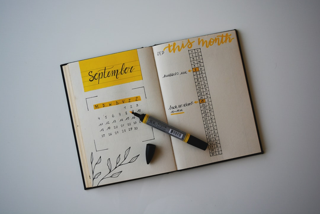 calendar with sticky notes and pen