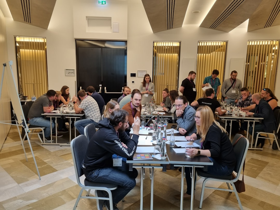 people collaborating around a laptop meeting